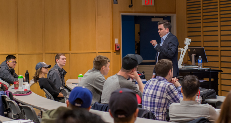 Terry speaking with students