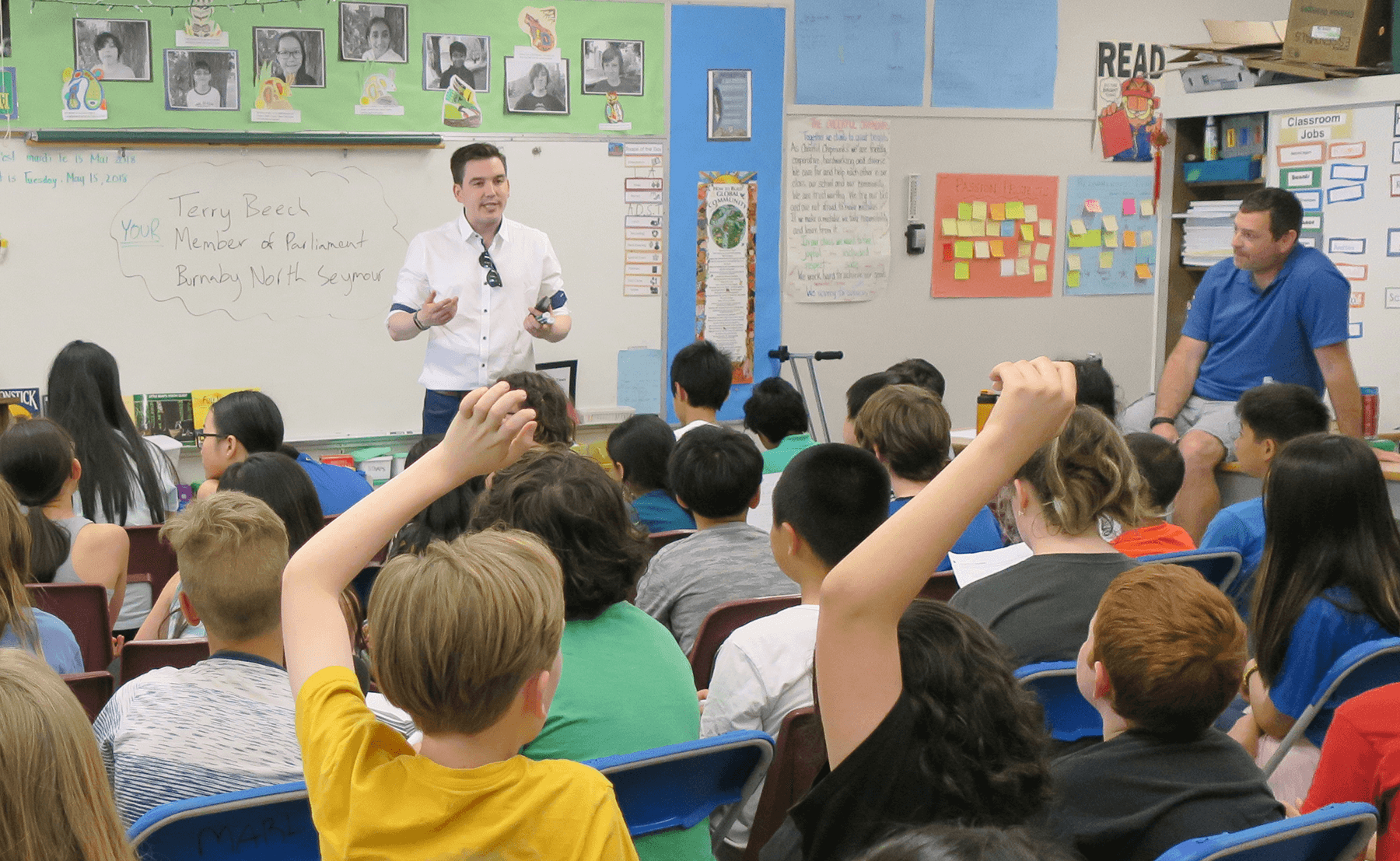 Terry presenting in front of a class of young students